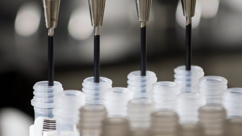 a group of plastic cups sitting on top of a machine